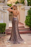 A woman wears the Juliet JT2734H, a leopard print dress featuring a lace-up back, standing in an outdoor setting with classical architecture and greenery, facing away from the camera.