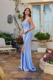 Woman wearing the elegant Juliet JT2698A long prom dress—a blue strapless satin gown with a fitted corset bodice and flared skirt standing outdoors on a patio with plants and furniture.