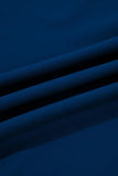 Close-up of blue fabric with folds on a dark background