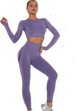 Woman wearing a purple athletic outfit on a white background